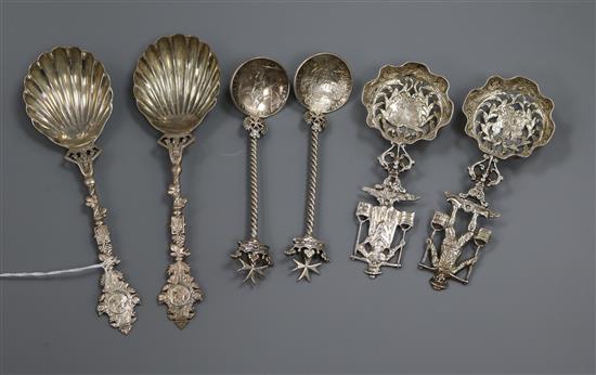 A pair of late Victorian silver serving spoons, a pair of Dutch silver silver spoons and one other pair of spoons with coin bowls.